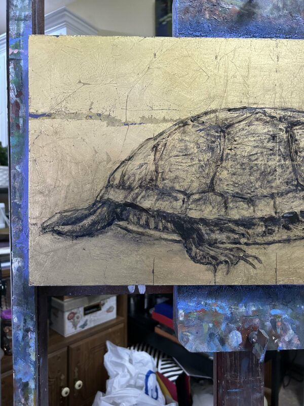 Rear view of the tortoise on the easel.